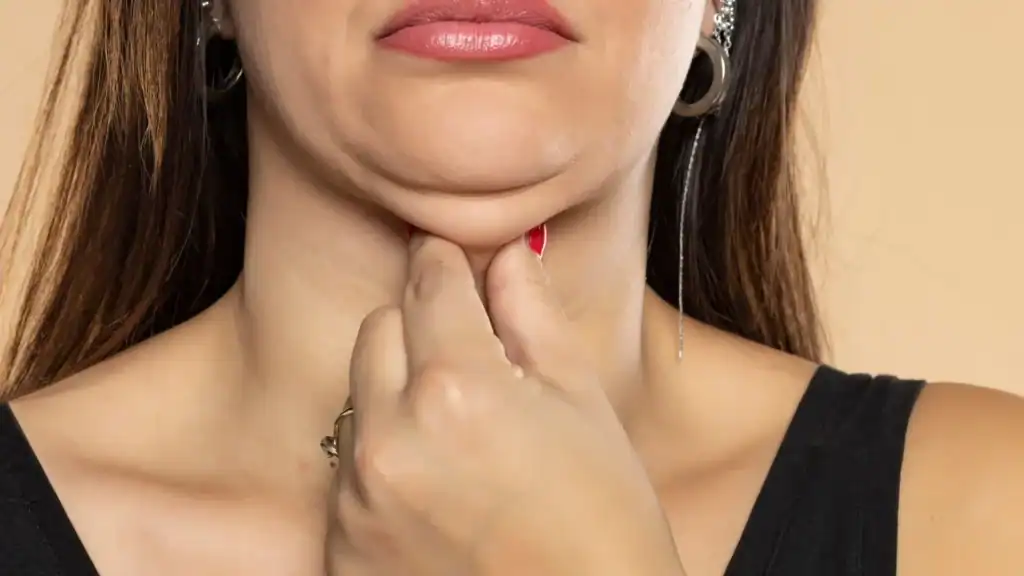 An image of a woman with double chin, sad, worried : Non Surgical Double Chin Removal Treatment in Cirencester, UK